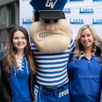 Louie the Laker poses with group of alumni